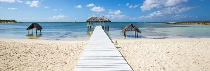 Excursion to Carbonera, Matanzas, Boca de Camarioca, and Santa Marta. During this excursion to Carbonera, Matanzas, Boca de Camarioca, and Santa Marta, discover the beauty of diverse Cuban landscapes, between villages, mangroves, and cenotes, while savoring Cuban rums. Itinerary: Your day will begin with a pickup from your hotel in Varadero, then a classic car ride will lead you to the first stop: Coral Beach. Upon arrival, you will have the possibility to rent snorkeling equipment to explore the crystal-clear waters and the colorful marine life that inhabits Coral Beach. Next, direction Matanzas, a city rich in stories and mysteries, where you will stroll through the historic center, admiring the colonial houses, the San Carlos Borromeo Cathedral, the Sauto Theater as well as several museums that will immerse you in the history of the region. After your visit to Matanzas, you will reach the cenote of the Saturn Cave, a source of transparent water. Enjoy an hour to swim and relax in this enchanting setting with shades of blue. Subsequently, direction Boca de Camarioca, where you will learn to prepare a Cuban mojito on its dream beaches. You will continue your adventure with a passage through the preserved La Conchita beach and the artificial Plaza Oasis beach of Varadero, before reaching Santa Marta. At the Agropecuario market, embark on a bicycle taxi, a fun means of transport, which will lead you to a restaurant where a traditional lunch awaits you, accompanied by an authentic Cuban cocktail. You will discover the Casa Naranja, located a few minutes from Santa Marta, where you will conclude this moment with a tasting of four Cuban rums, coffee, chocolate, and tobacco. You will also have the opportunity to visit the El Resplandor agro-ecological estate, where you will meet a local farmer and taste fresh seasonal fruits. Finally, the day will end with a break at Las Américas beach, one of the most beautiful in Varadero, before returning to your hotel in a classic car after nine hours of excursion.