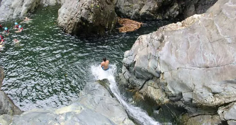 From San Juan: El Yunque water slide with transport